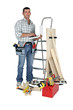 Carpenter stood with laptop