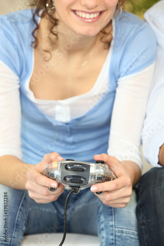 Photo: Woman playing a video game Woman playing a video game