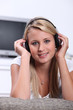 Teenage girl listening to music on headphones
