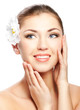 Closeup beautiful woman face with flower