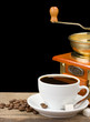 cup of coffee and grinder