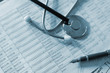 Stethoscope on medical billing statement on table
