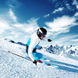 Skier in mountains, prepared piste