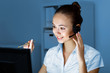 Young woman in business wear and headset