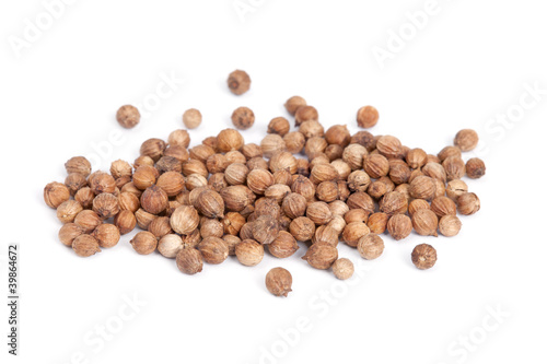 Photo: Heap Coriander Seeds (Coriandrum sativum) isolated on white Heap Coriander Seeds (Coriandrum sativum) isolated on white