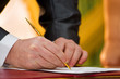 the golg pen at the man's hand