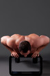 Photo: Adult muscular man, on the grey background Adult muscular man, on the grey background