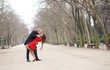 Dating couple dancing in a park