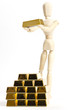 Gliederpuppe mit Goldbarren