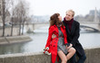 Dating couple at the Parisian embankment