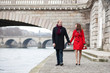 Beautiful romantic couple on a Parisian embankment at spring or
