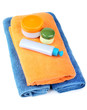 Terry towels and tubes with cosmetics isolated on a white Terry towels and tubes with cosmetics isolated on a white
