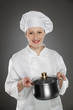 Young female chef  with pot