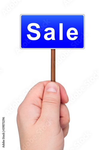 Photo: Hand holding sign SALE. Hand holding sign SALE.