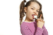 Girl with a lollipop, isolated on white background