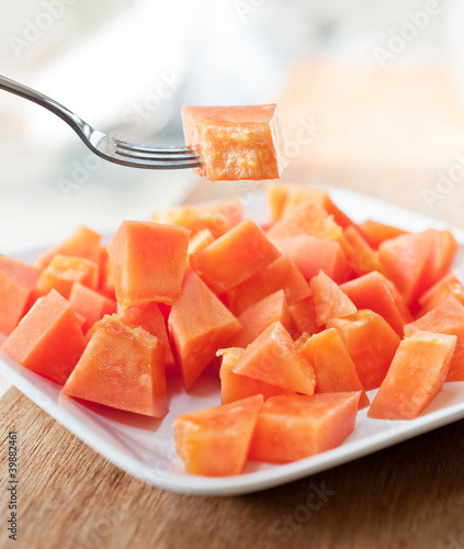 Photo: Papaya on white dish Papaya on white dish
