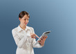 Sexy brown haired model using new touch pad device
