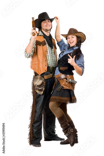 Photo: Cheerful young cowboy and cowgirl Cheerful young cowboy and cowgirl