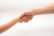 Child vs man hand shake