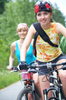 two  young girls on bicycle