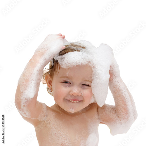 Photo: baby washing hair in bath as logo. Isolated with clipping path baby washing hair in bath as logo. Isolated with clipping path