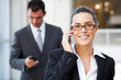 Photo: beautiful young businesswoman talking on cell phone beautiful young businesswoman talking on cell phone