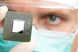 Scientist examining a microchip.