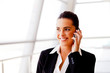 pretty young businesswoman talking on cell phone