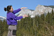 Woman playing in the mountains in early spring