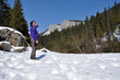 A trekking girl in the snowy mountains in the Carpathians, Roman