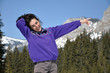 Portrait of a young woman at winter in the mountains