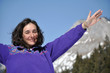 Portrait of a young woman at winter in the mountains
