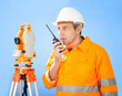 Senior land surveyor with theodolite