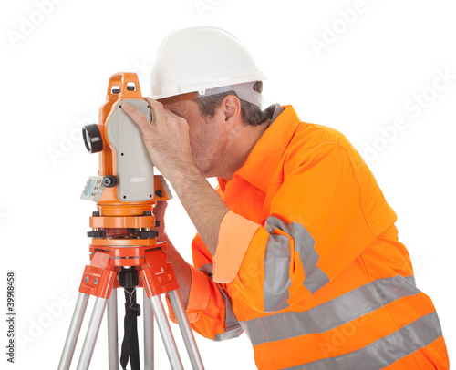 Photo: Senior land surveyor with theodolite Senior land surveyor with theodolite