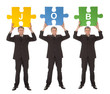 Group of business people holding jigsaw puzzle
