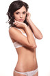 hot smiling female model posing in white lingerie