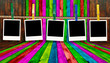 Blank Polaroids Hanging on Rope on Multicolored Wood Background