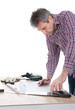 Worker looking into a house plan