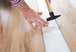 Worker assembling laminate floor