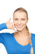 woman making a call me gesture