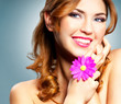 Beautiful happy smiling woman with long curly hair