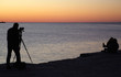 Photographer take a picture at sunset