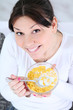 Woman eating cornflakes cereals