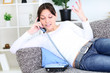 Young woman on the phone at home
