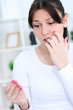 Woman looking at a pregnancy test
