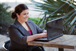 Businesswoman - Telecommuting from Internet Cafe