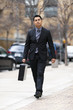 Hispanic Businessman - Walking Downtown With Briefcase