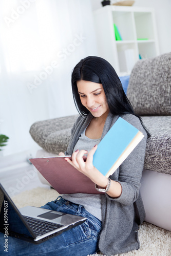 Photo: pretty young girl with laptop learning pretty young girl with laptop learning