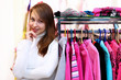 Young woman inside a store buying clothes