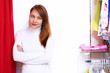 Young woman inside a store buying clothes